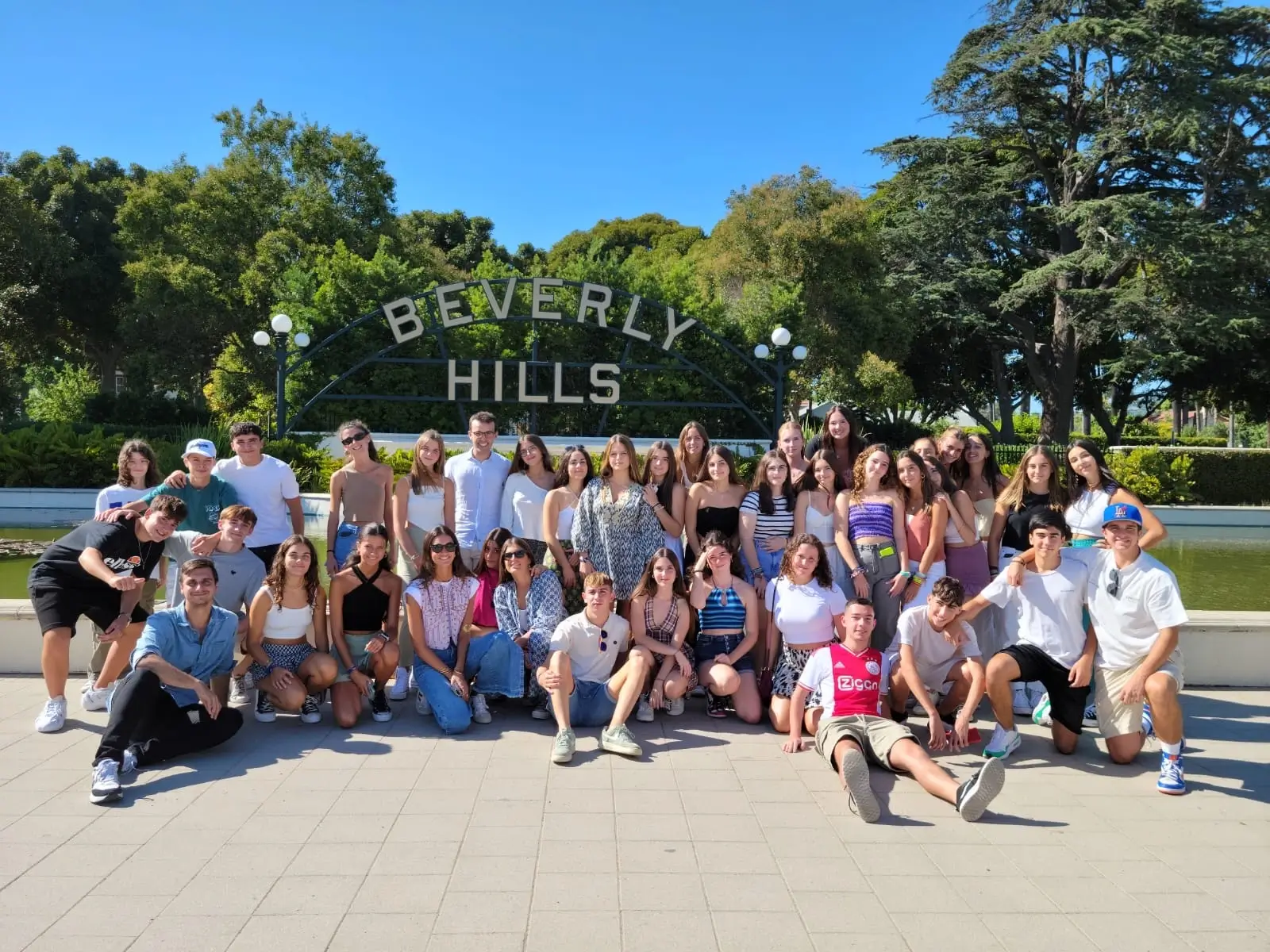 International students in Group Homestay Specialized Programs posing at the Beverly Hills sign in California