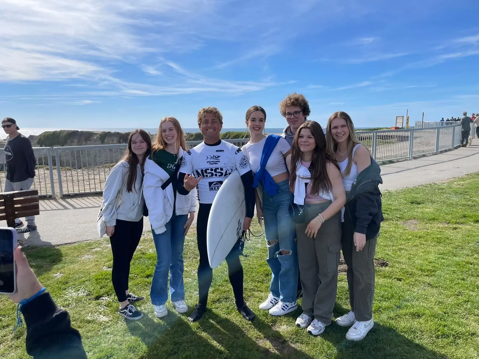 ERDT enVision Group Homestay Specialized Programs students meeting a surfer on a California beach