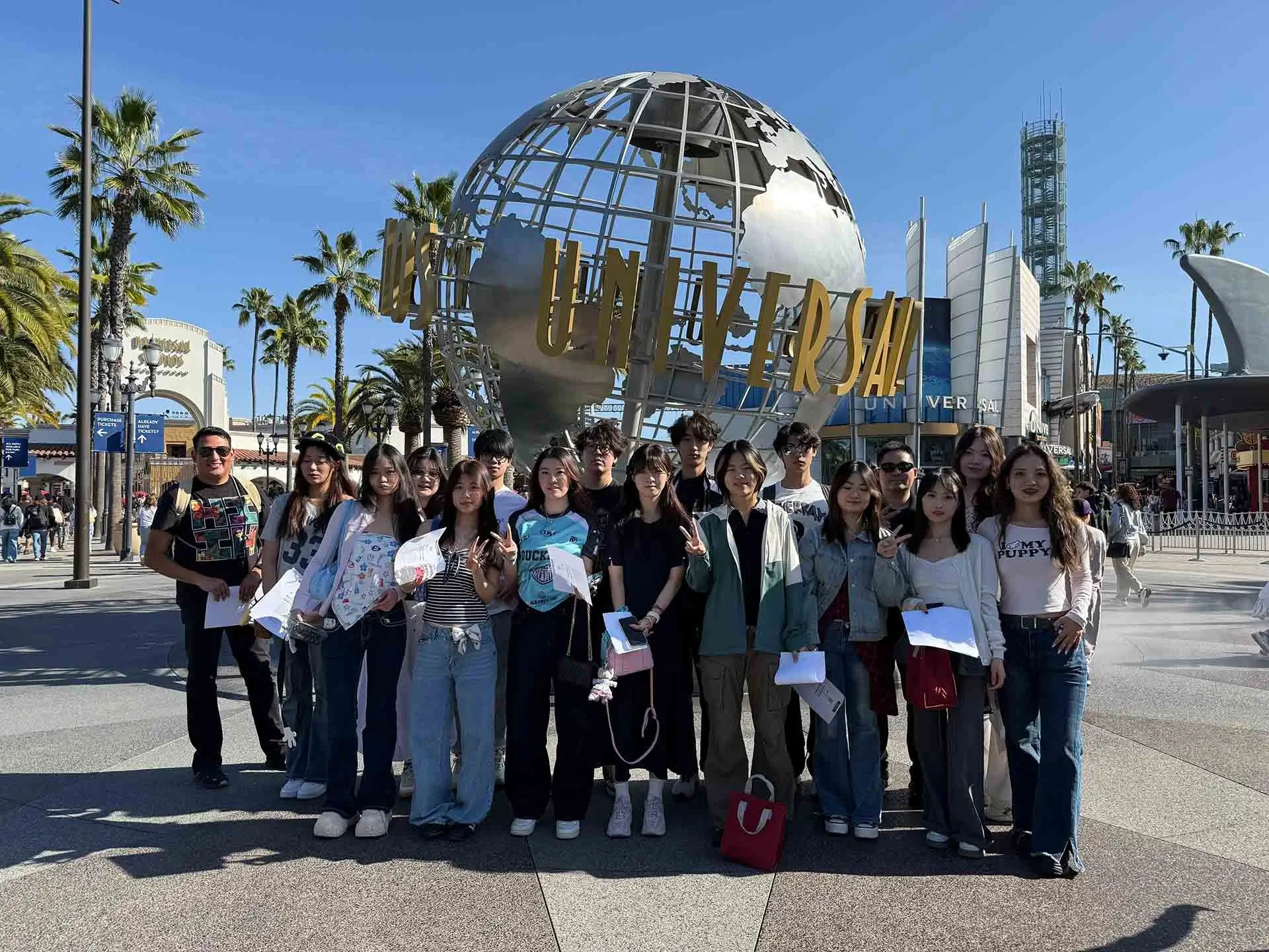 YCE University Program students pose in front of the Universal Studios globe in California
